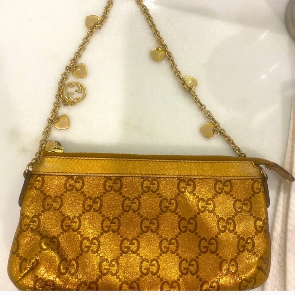 Gold Gucci purse